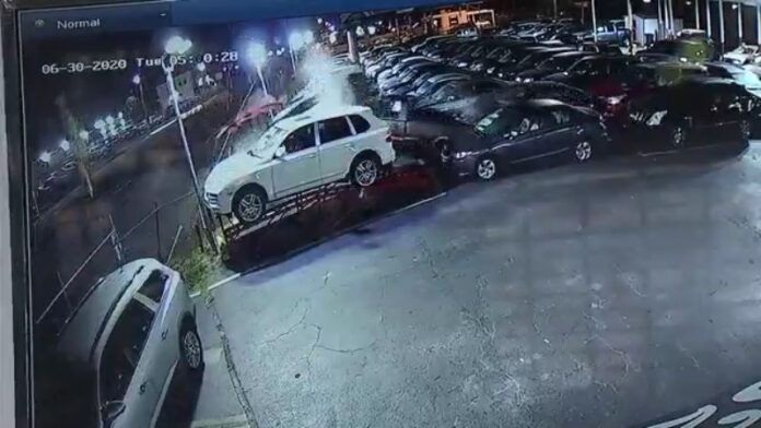 video:-car-crashes-into-florida-dealership,-lands-on-cars