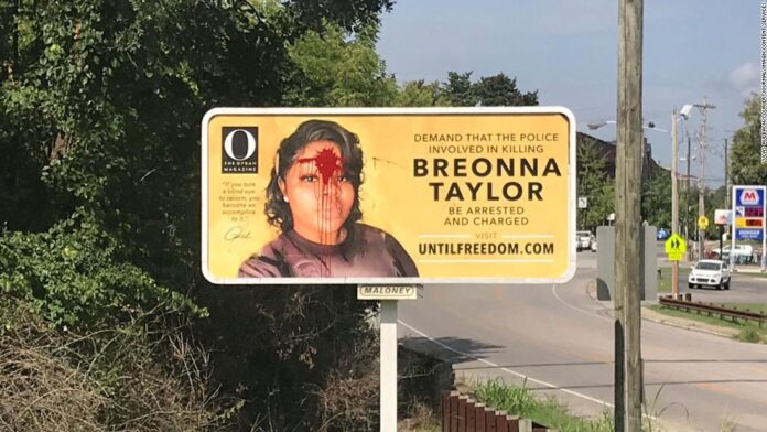a-breonna-taylor-billboard-was-vandalized-with-red-paint