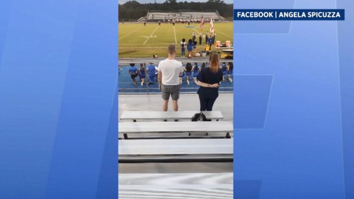 family-claims-cheerleading-coach-forced-girl-to-kneel-during-national-anthem